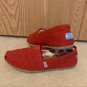 Women’s red classic Toms slip ons size 8